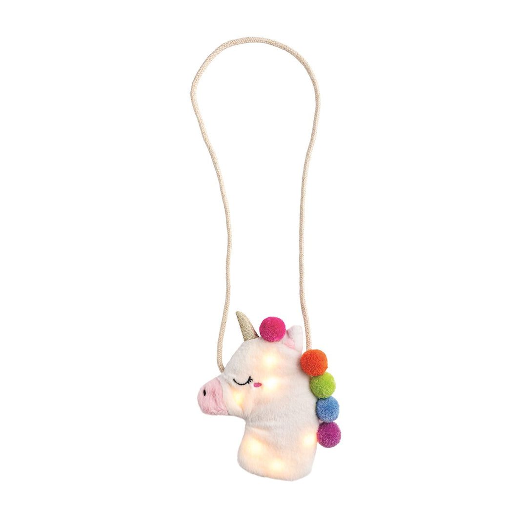 Unicorn-shaped plush purse with colorful pom-poms on a white background