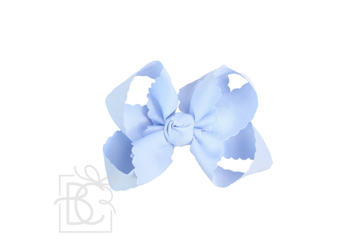 A light blue grosgrain ribbon hair bow with scalloped edges, centered on a plain white background.