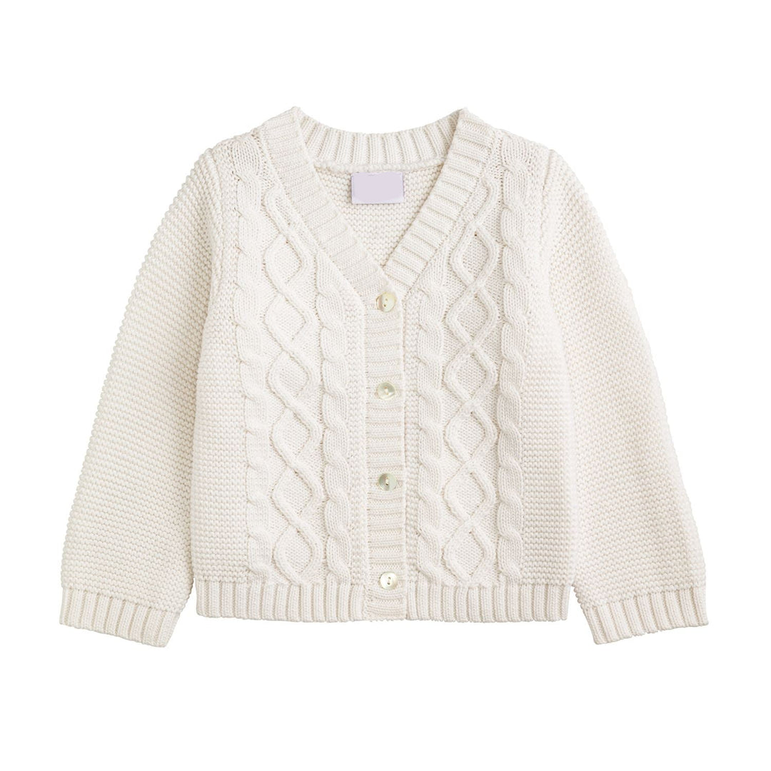 White cable knit cardigan on a white background