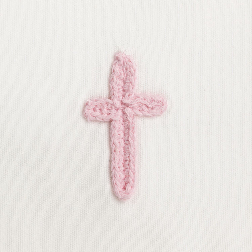Cotton interlock bib features crochet cross icon and picot stitch detail.