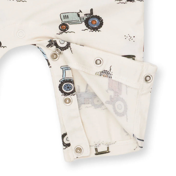Angel Dear Future Farmer Uni Romper close-up of the baby romper highlighting the print, closures, and finishing details