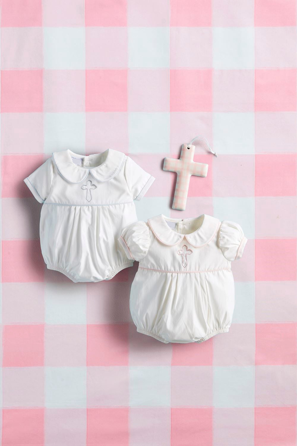 white baby bubbles with blue embroidered cross & pink embroidered cross with ceramic cross on gingham background