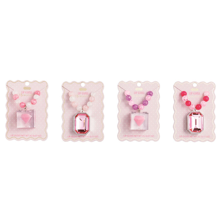 Four pink beaded necklace gift sets on pink backing cards, arranged side by side on a white background. The necklaces feature heart and rectangular pendant charms in shades of pink, red, and purple.