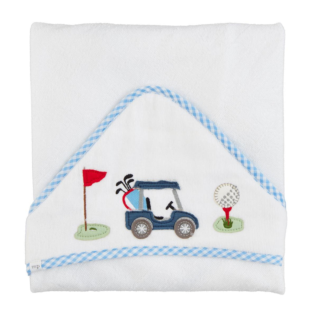 Children's towel with golf-themed design on a white background