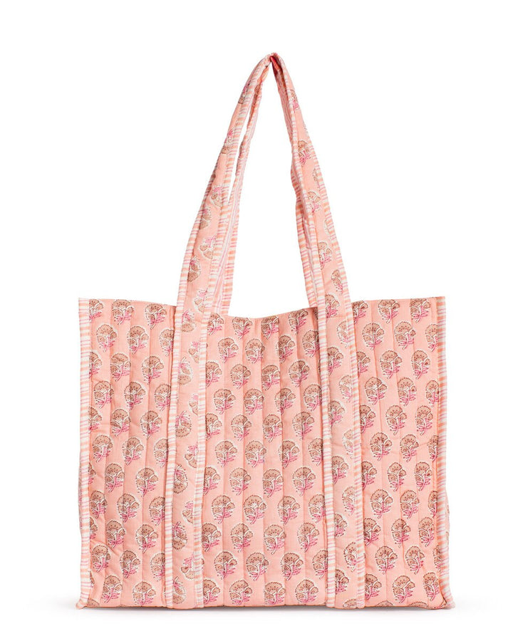 Pink tote bag with floral pattern on a white background