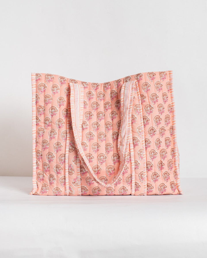 Pink patterned blanket on a white background