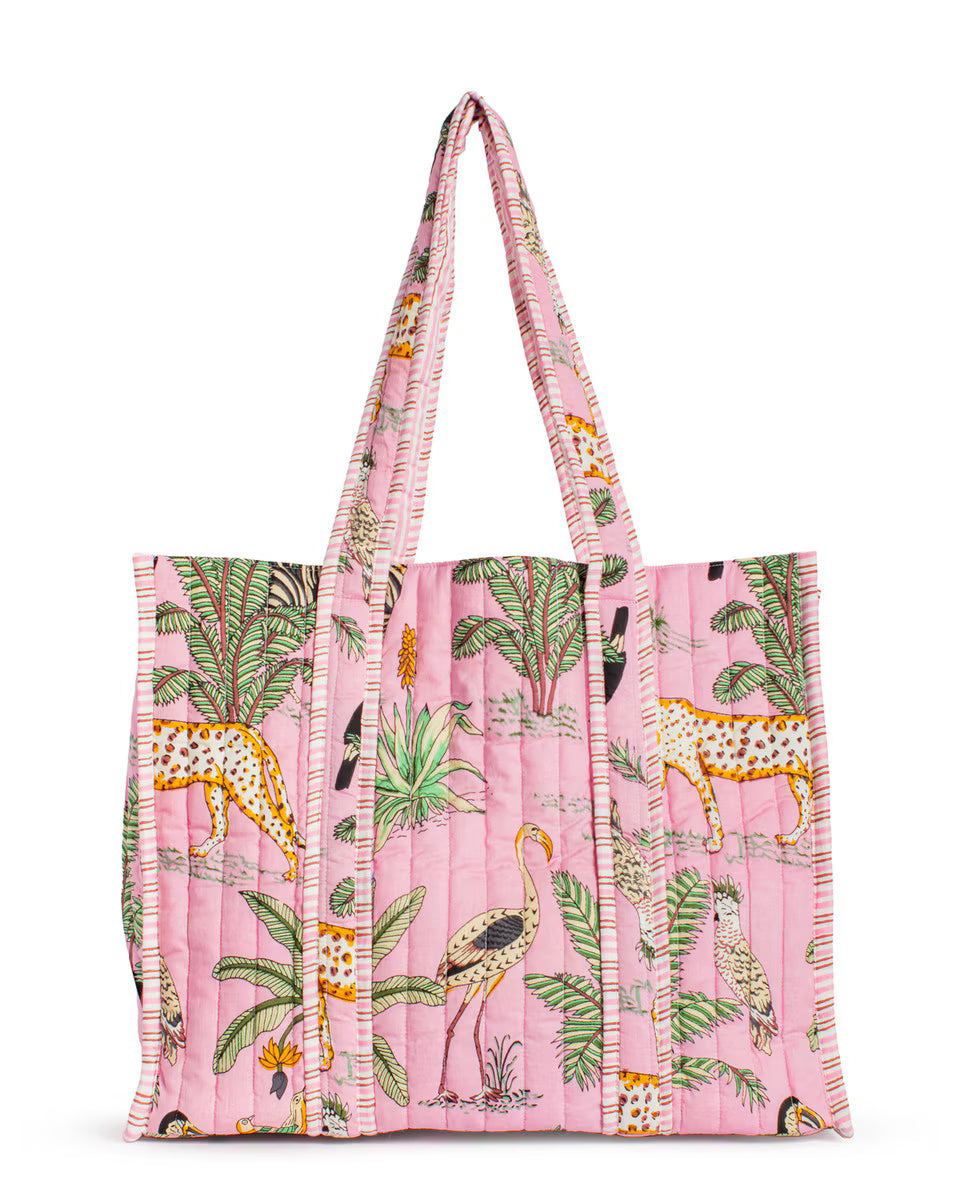 Tote bag with a pink background and animal pattern on a white background