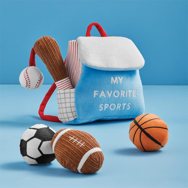 Plush sports bag with sports-themed toys on a blue background