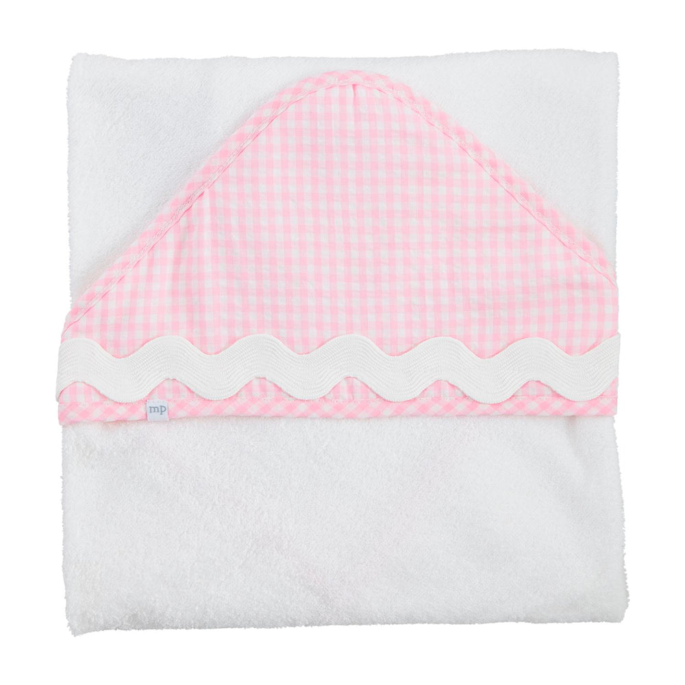 Folded white towel with pink checkered border on a white background
