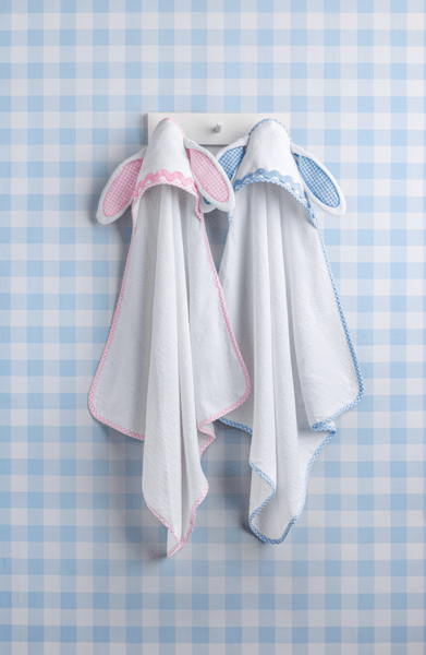 PINK AND BLUE BUNNY HOODED TOWEL ON GINGHAM BACKGROUND