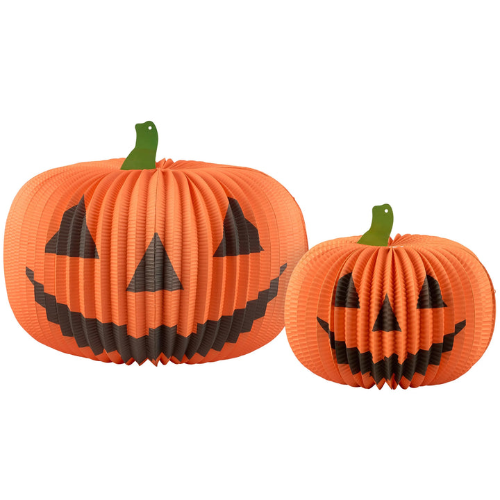 Two orange paper pumpkins with black faces on a white background