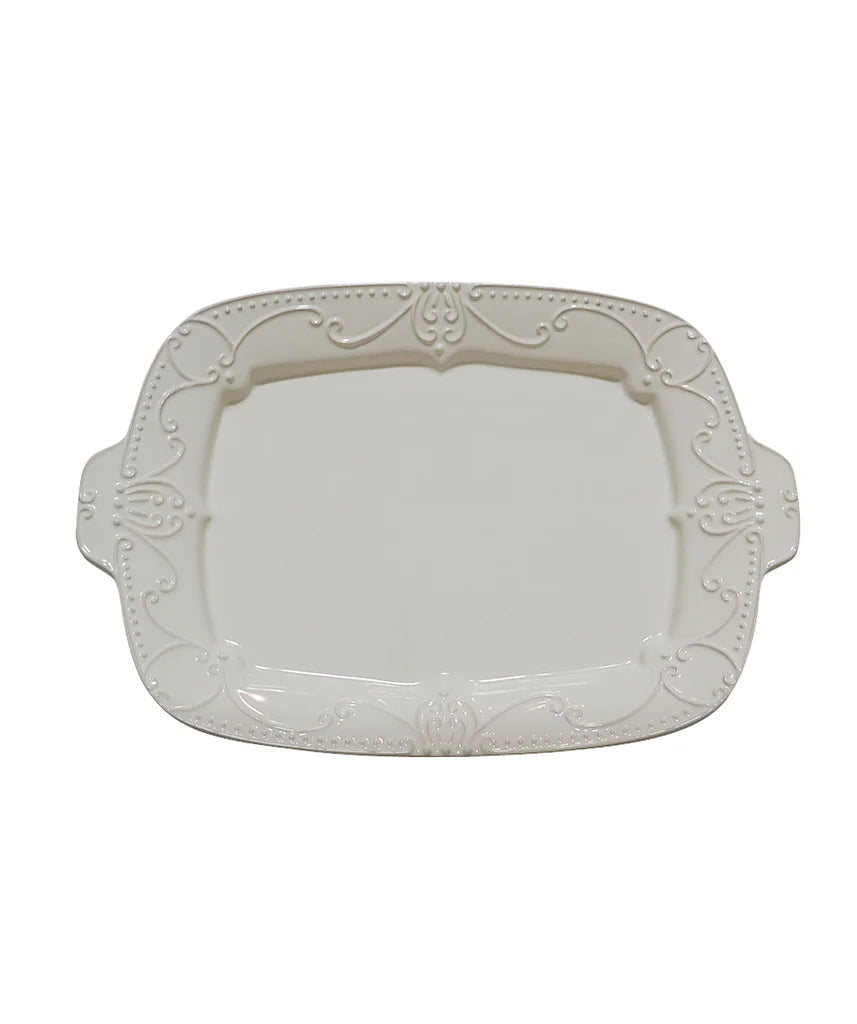 An off-white ceramic serving platter with ornate embossed scrollwork and decorative handles, shown on a plain white background.