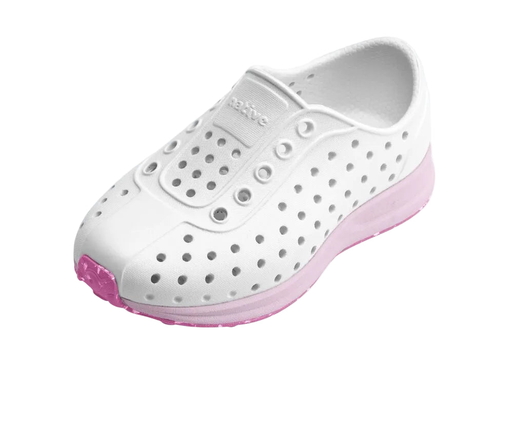 White clog shoe with pink sole on a white background