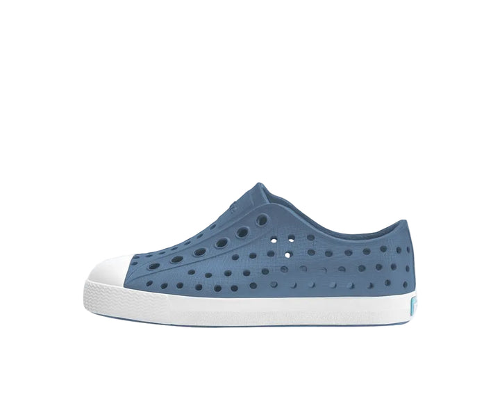 Blue shoe with white sole on a white background
