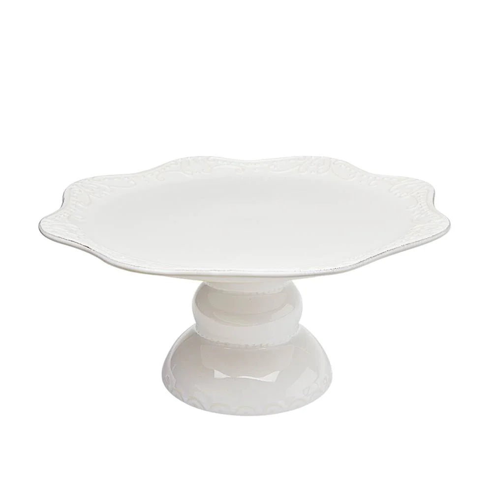 White ceramic cake stand on a white background