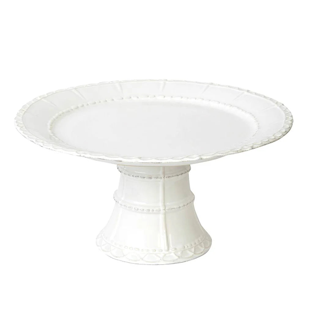 White ceramic cake stand on a white background