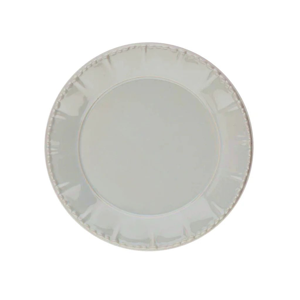 Light baby blue plate with a subtle pattern on a white background