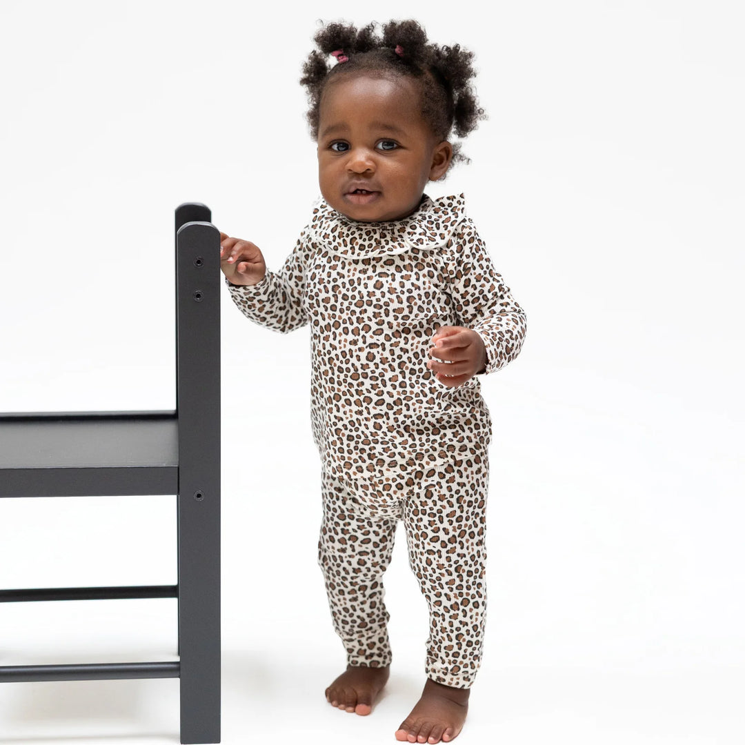 Angel Dear Leopard Rib Long Sleeve Ruffle Top and Pant Set worn by a baby in a lifestyle view highlighting the leopard rib ruffle design