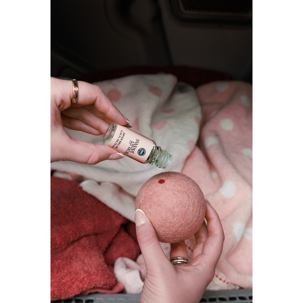 Sweet Grace Dryer Ball Kit with three reusable wool dryer balls and fragrance oil