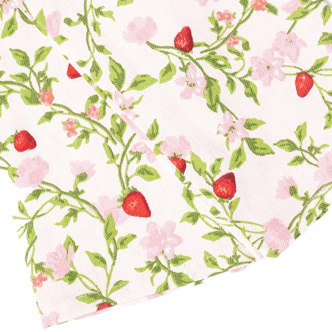 Floral and strawberry patterned fabric swatch on a white background