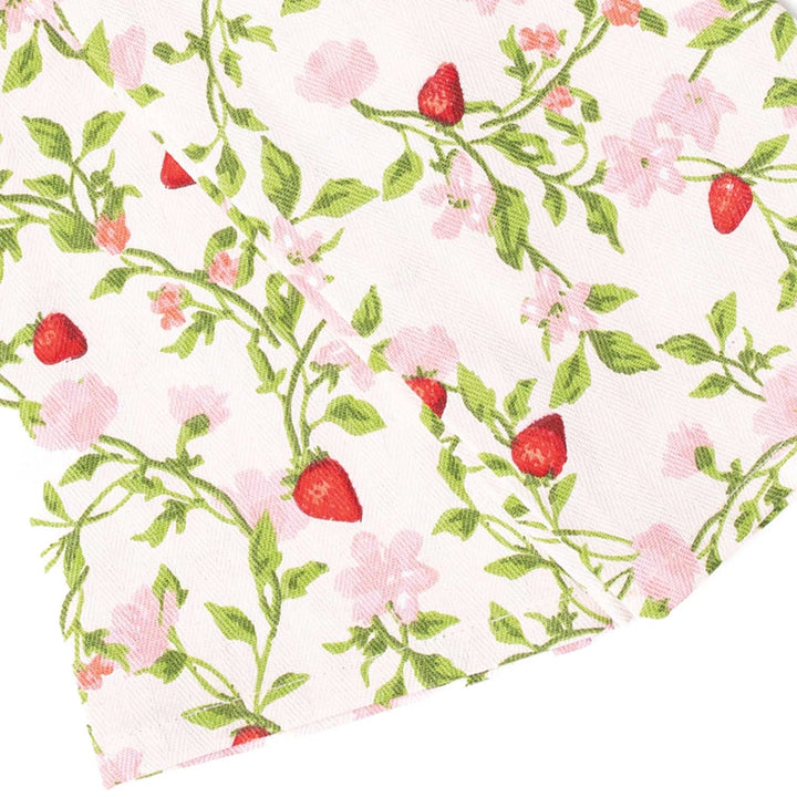 Floral and strawberry patterned fabric swatch on a white background