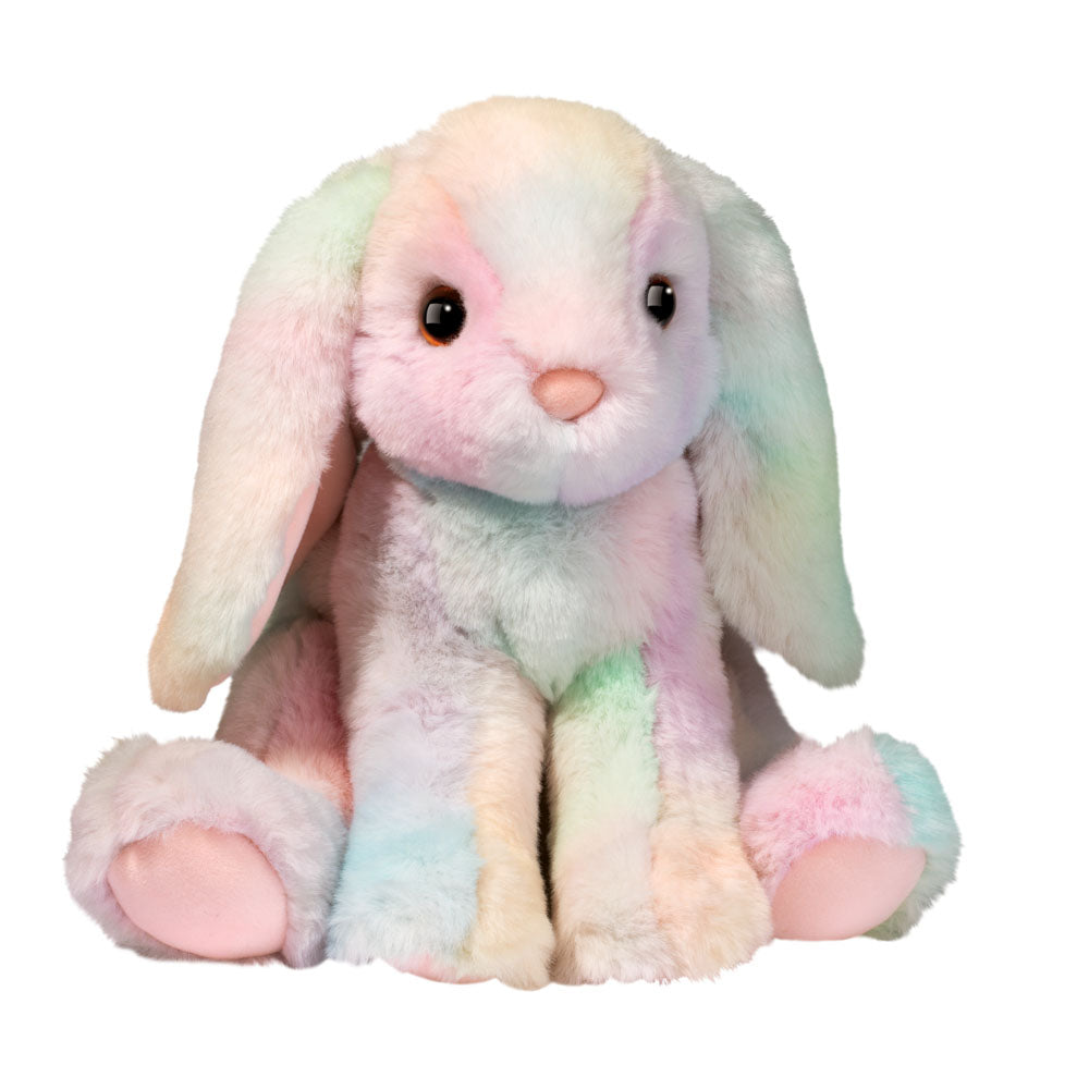 RAINBOW PASTEL STUFFED BUNNY SITTING ON WHITE BACKGROUND