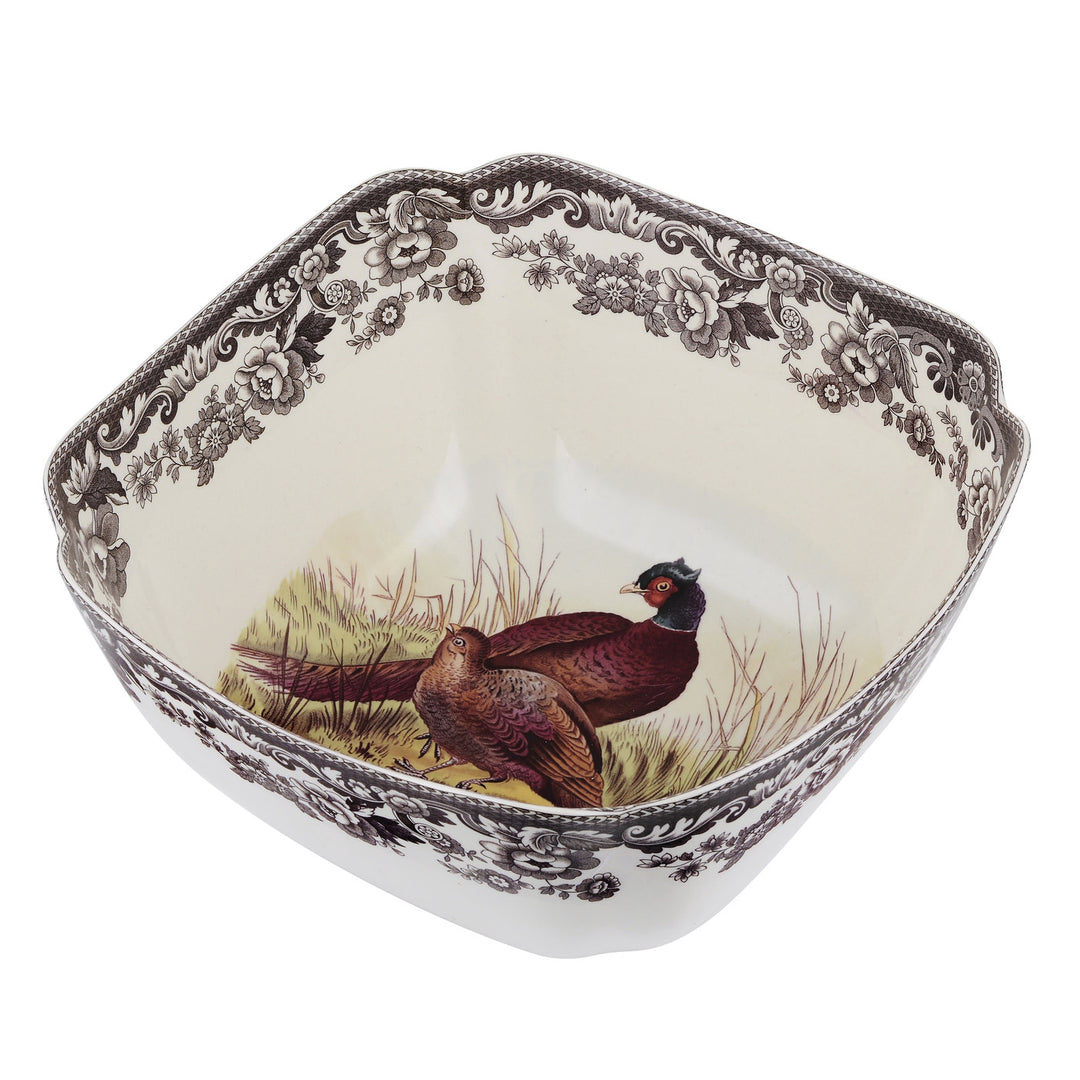 Decorative ceramic bowl with pheasant design on a white background