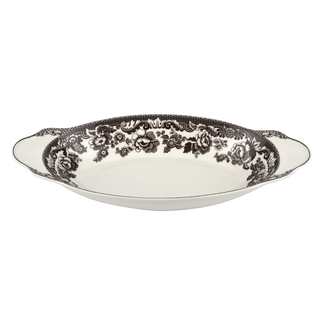 A fine porcelain bread tray with a British Flowers design border, predominantly in brown and white colors.