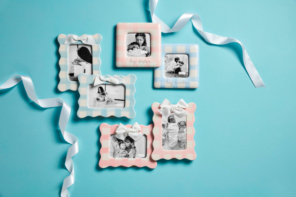 assortment of ceramic gingham frames on floor