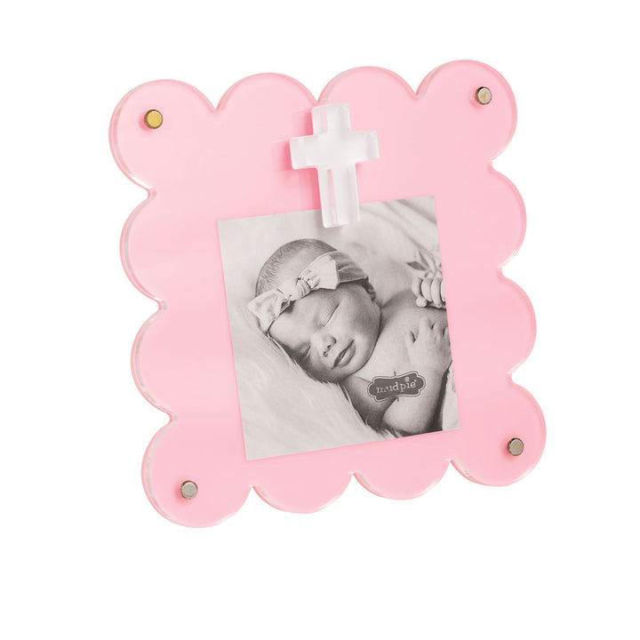 Pink scalloped acrylic picture frame with cross accent and gold magnetic details