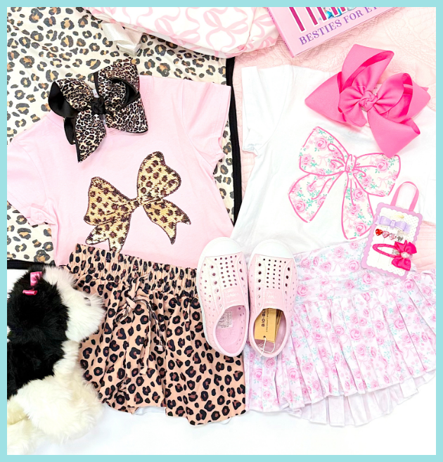 Pink and leopard print outfit with accessories on a white background