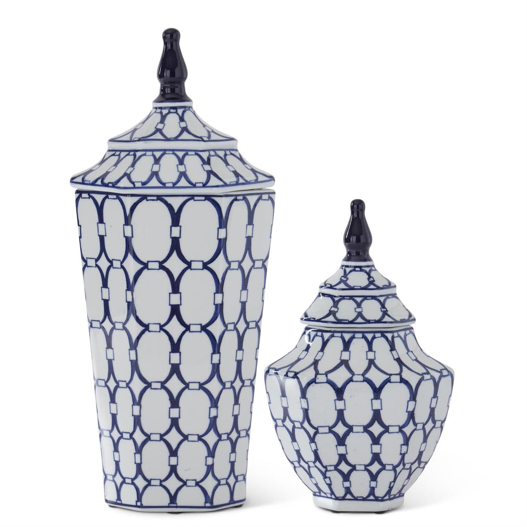 Two blue and white patterned ceramic jars on a white background