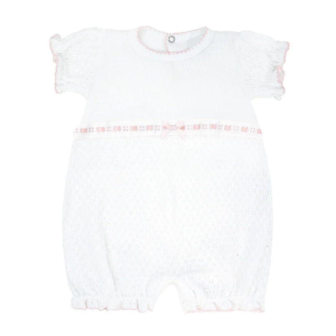 White baby romper with pink trim on a white background