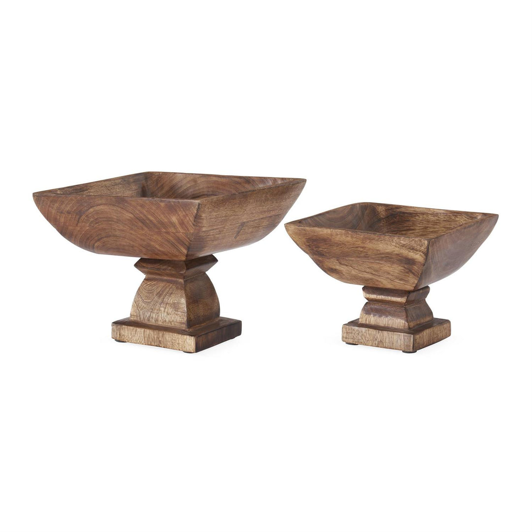 Two wooden bowls with decorative bases on a white background