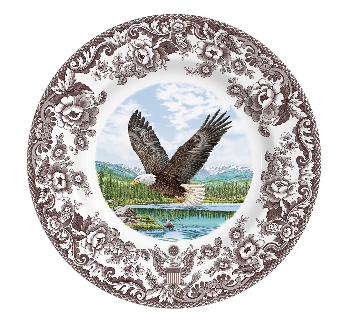 Decorative plate with an eagle design and floral border