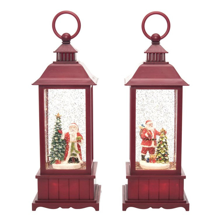 Two red lanterns with Christmas scenes inside on a white background