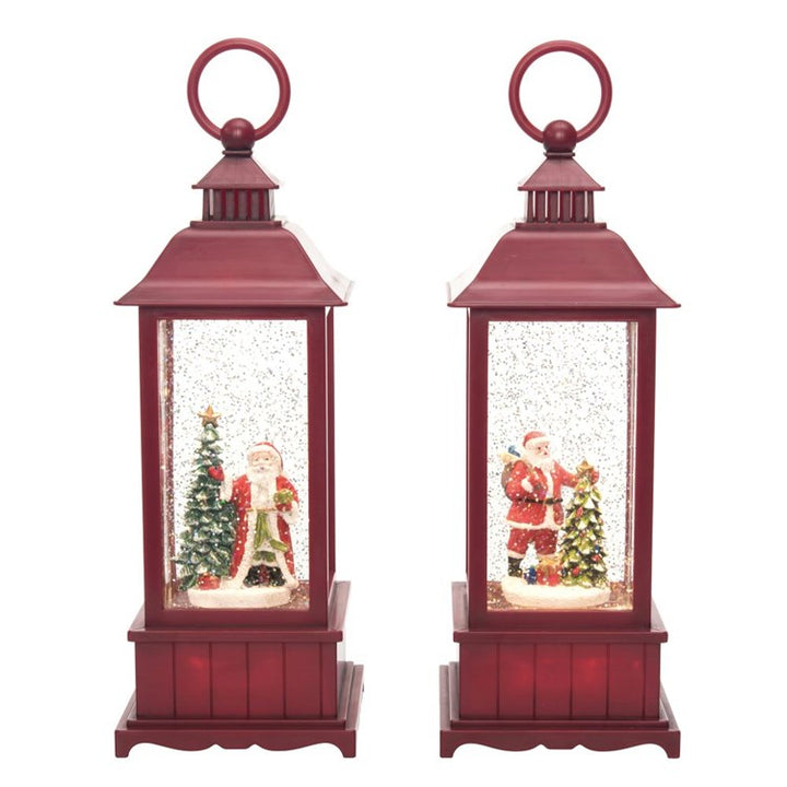 Two red lanterns with Christmas scenes inside on a white background