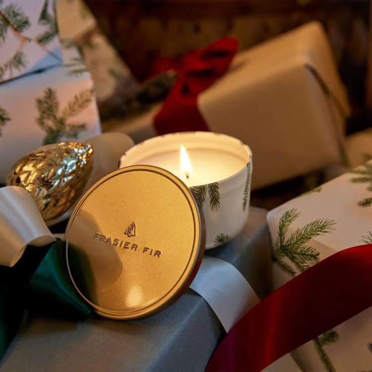 Frasier Fir travel tin candle shown open with gold lid