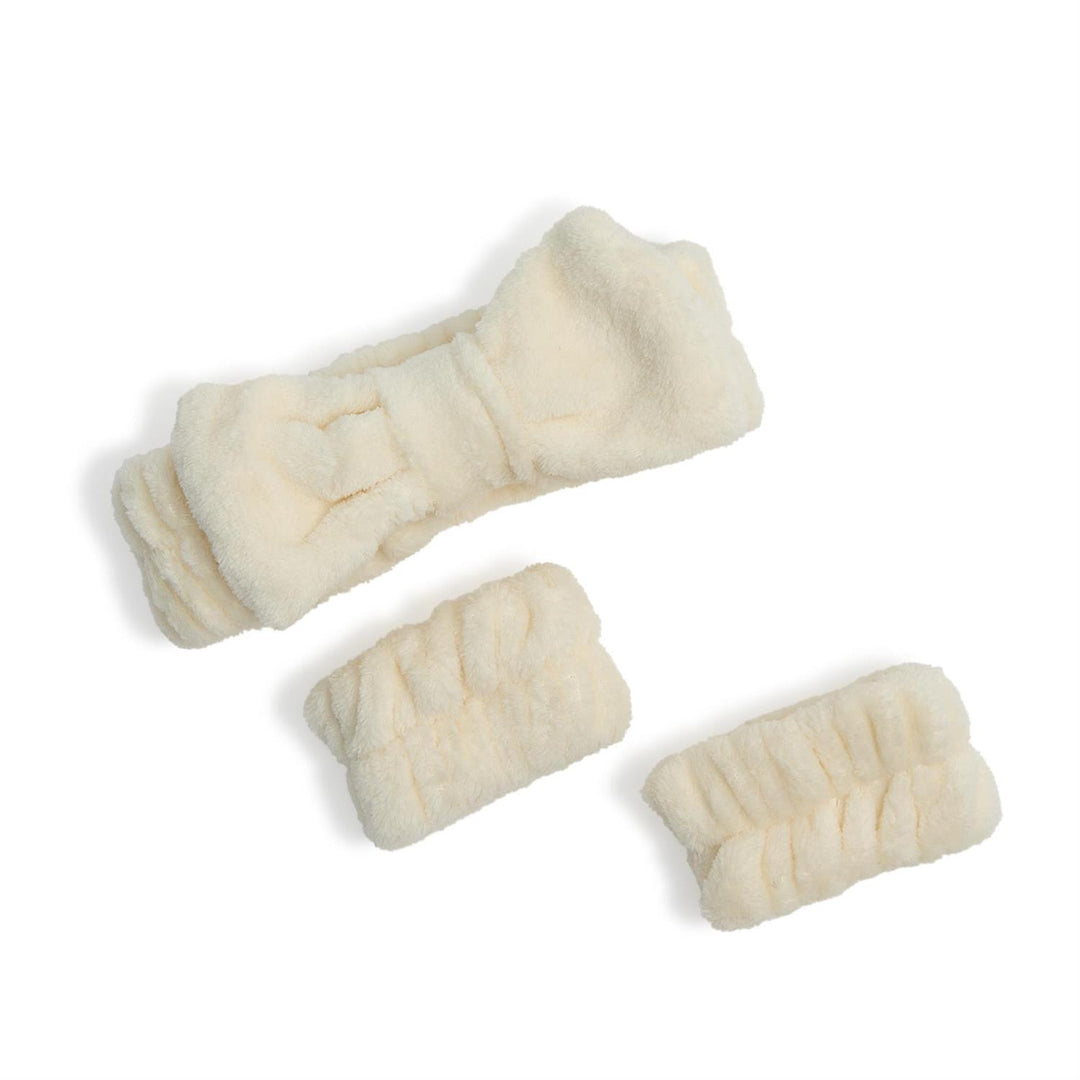 Three pieces of rawhide dog chew on a white background