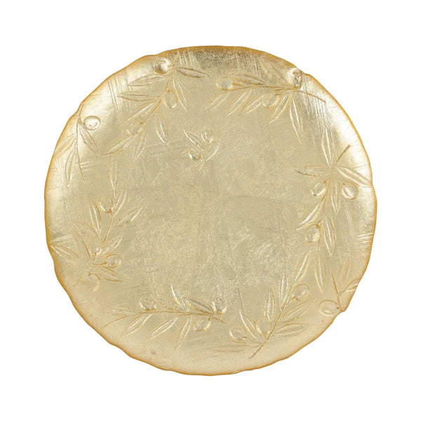 Round gold plate with engraved design on a white background