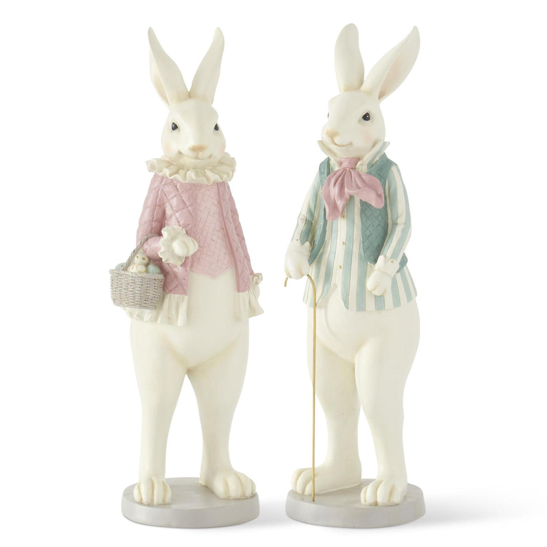 Two decorative rabbit figurines with pastel clothing on a white background