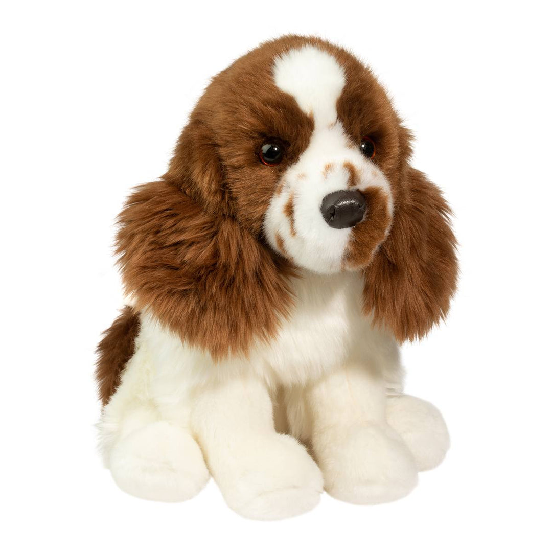 Brown and white spaniel puppy plush toy with soft fluffy fur, long floppy ears, embroidered facial details, and a black nose