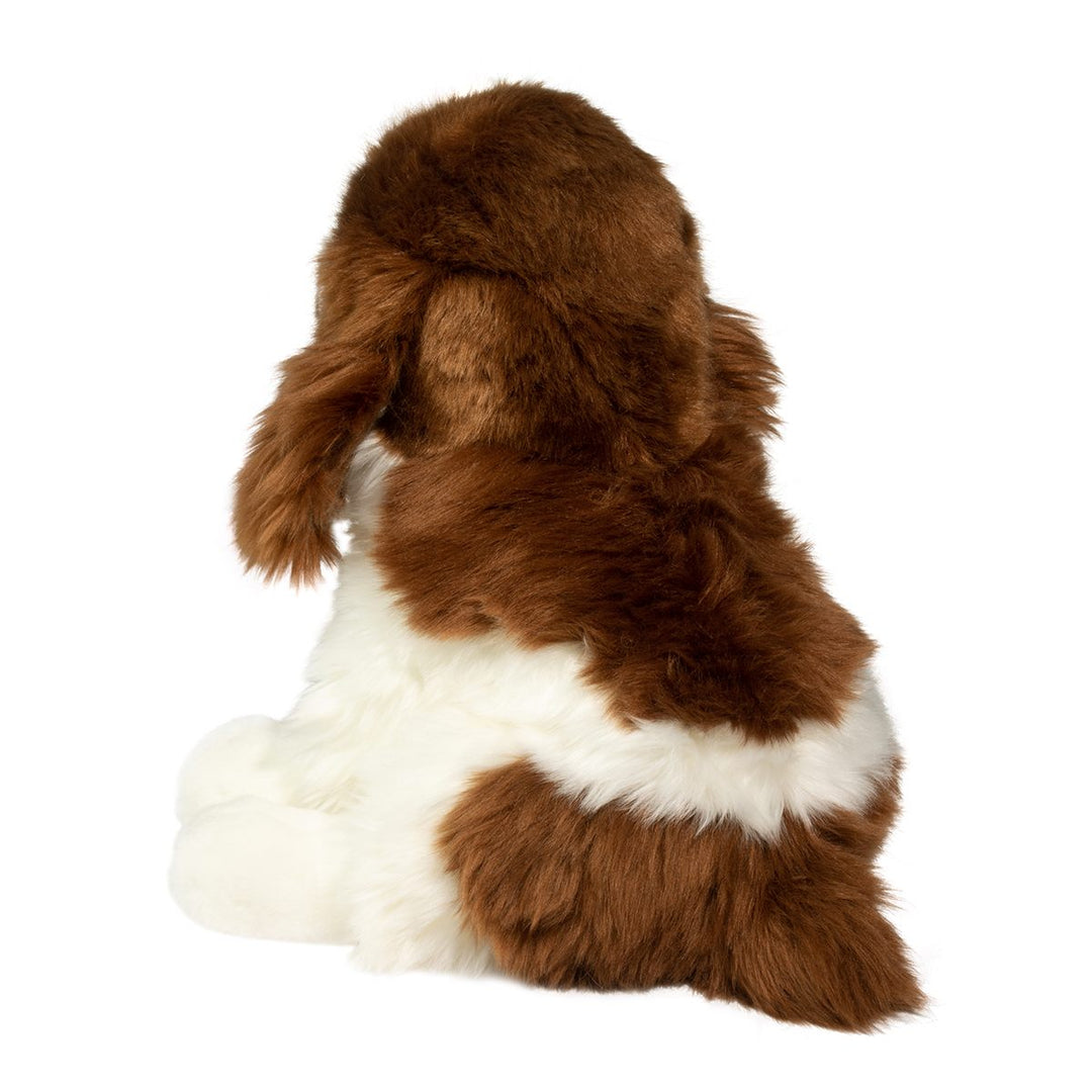 Brown and white spaniel puppy plush toy with long floppy ears, soft fluffy fur, and a fluffy tail, shown from the back