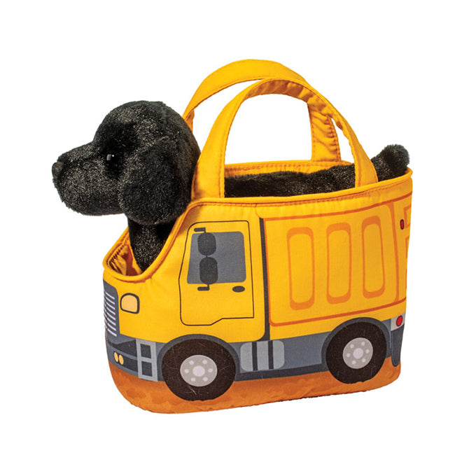 Black puppy plush toy peeking out of a yellow dump truck tote bag with padded handles and construction vehicle details | Walker Boutique
