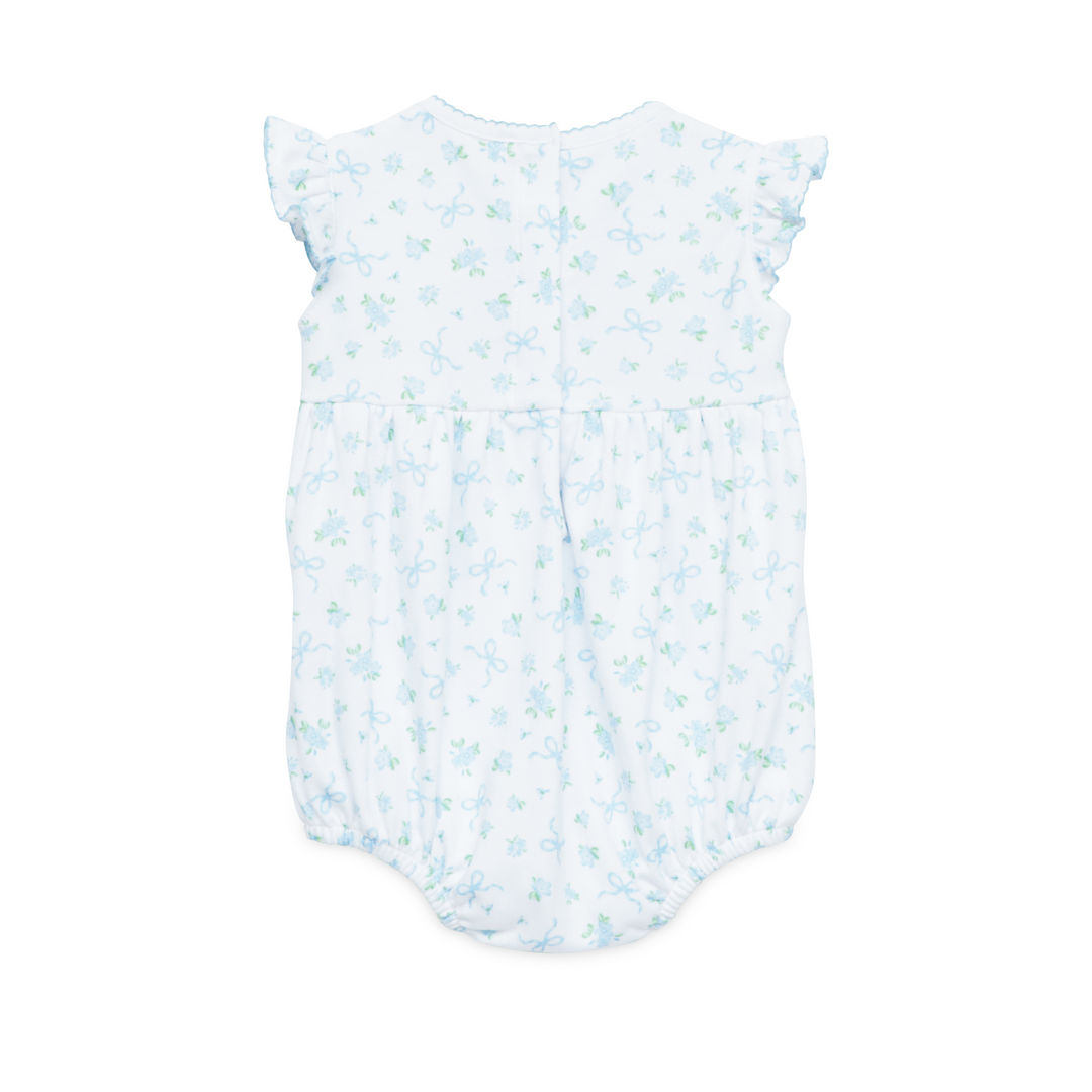 WHITE SMOCKED BUBBLE WITH FLUTTER SLEEVES AND ALL OVER BLUE AND GREEN BOW DESIGN