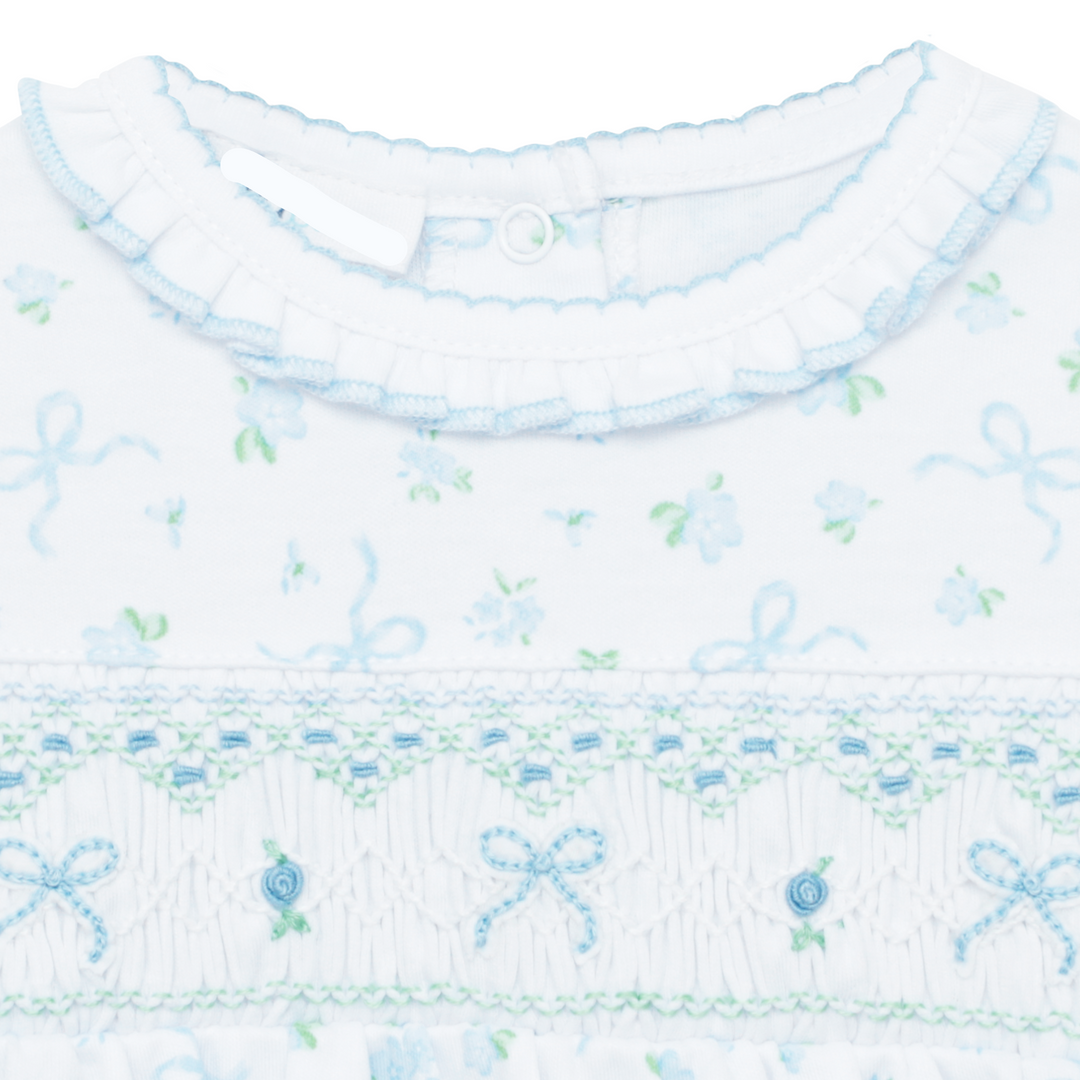 WHITE SMOCKED BUBBLE WITH FLUTTER SLEEVES AND ALL OVER BLUE AND GREEN BOW DESIGN