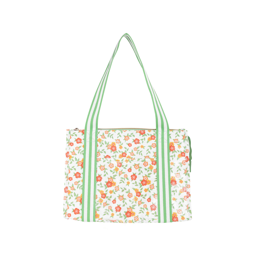 Floral tote bag with green straps on a white background