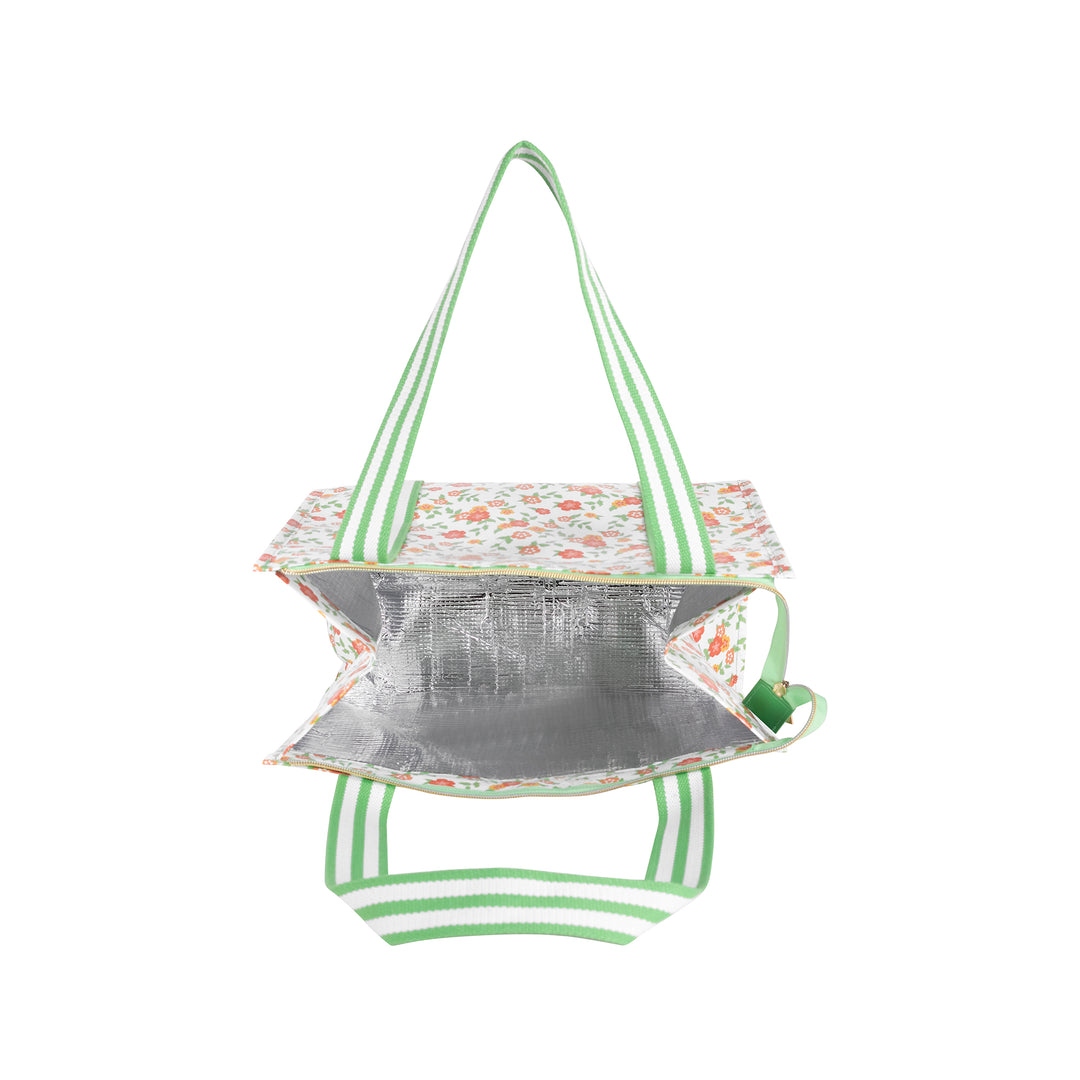 Floral-patterned cooler bag with green straps on a white background