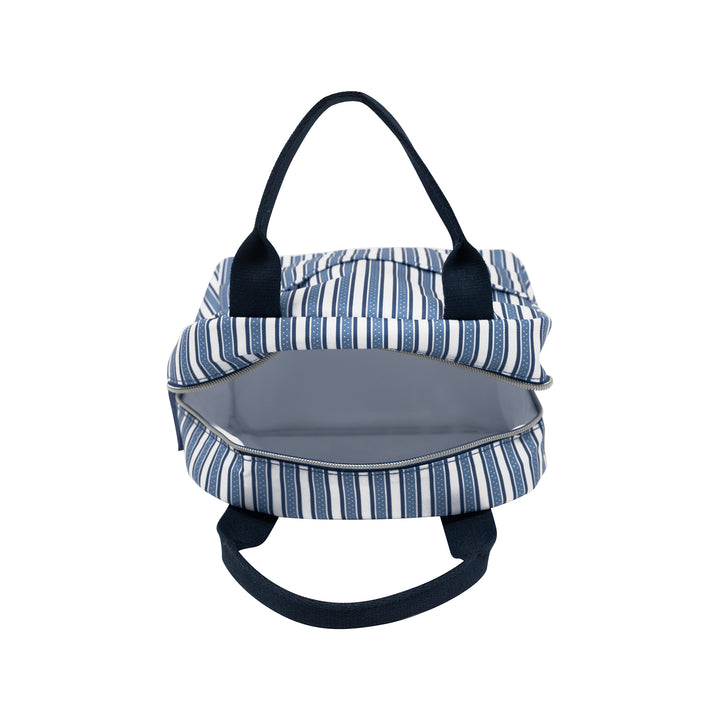 Blue and white striped pet carrier with black straps on a white background