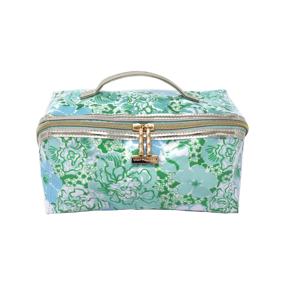 Floral patterned cosmetic bag with gold zipper and handle on a white background